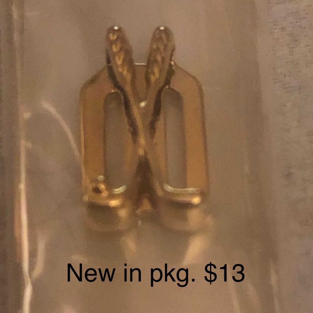 KEEP Collective gold golf clubs.